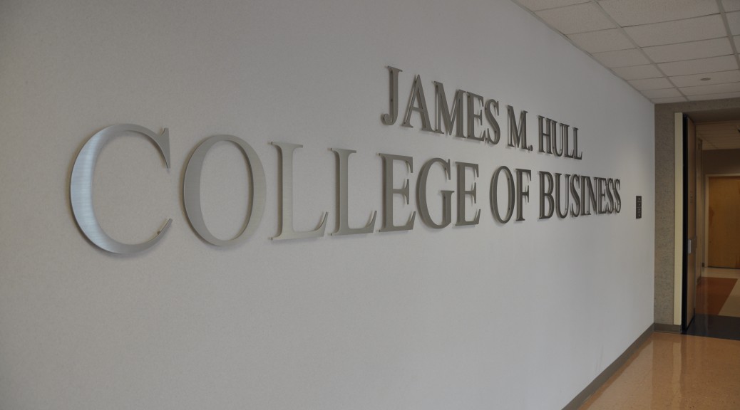 sign in a hallway that reads James M. Hull College of Business