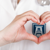 hands being formed in the shape of a heart