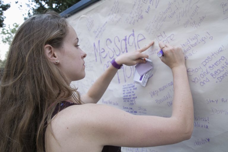 woman writing on paper