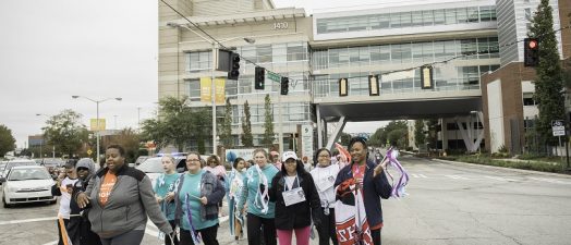 Group of people walking along a road