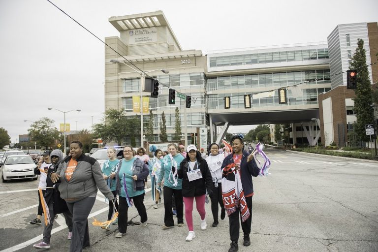 Group of people walking along a road