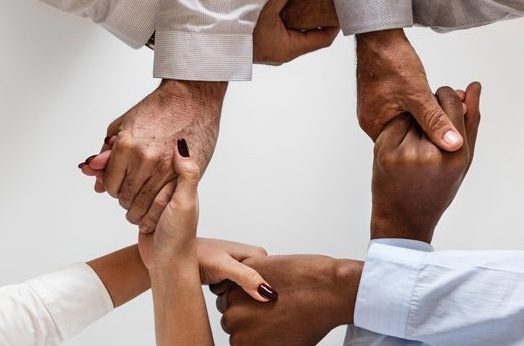 People holding hands.