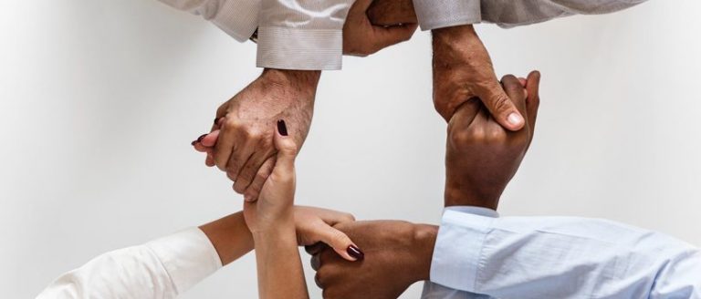 People holding hands.