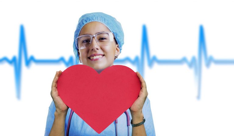 nurse holding a heart