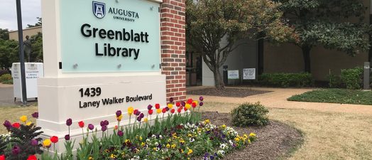 Greenblatt Library sign in front of building
