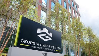 exterior of a building with a sign that says georgia cyber center