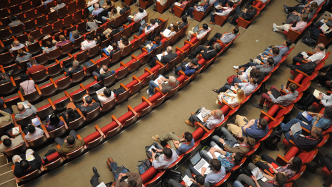 people sitting in an auditorium