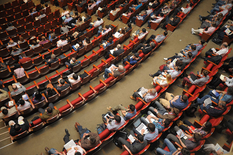 people sitting in an auditorium