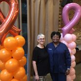 A cancer patient and nurse navigator posing for a picture.