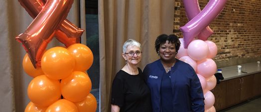 A cancer patient and nurse navigator posing for a picture.