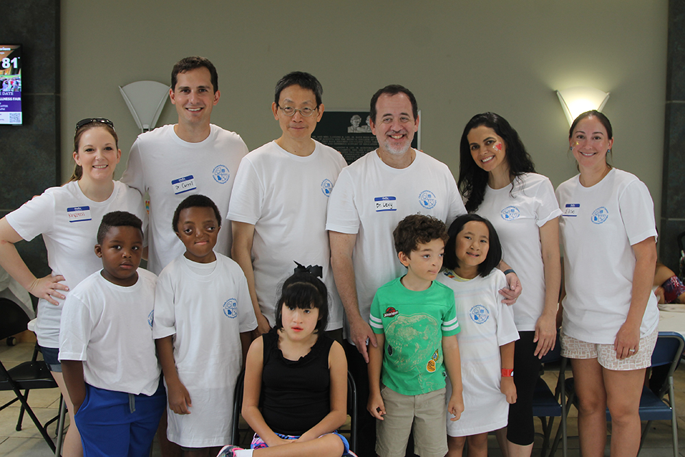 Doctors and children posing