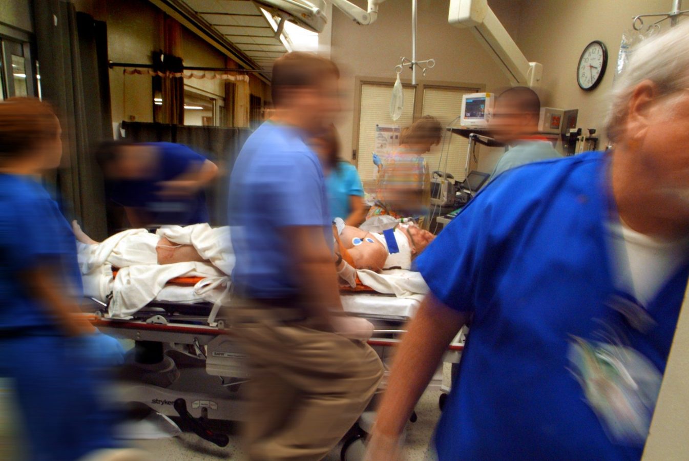 patient being helped in the emergency room