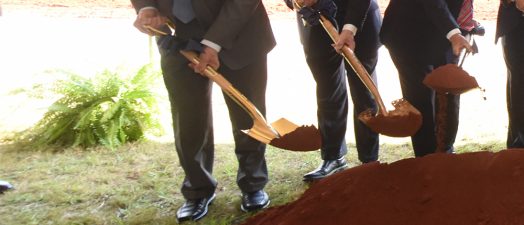 men with shovels at groundbreaking