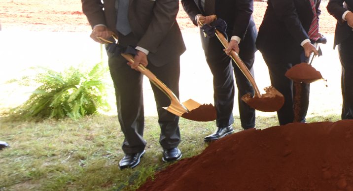men with shovels at groundbreaking