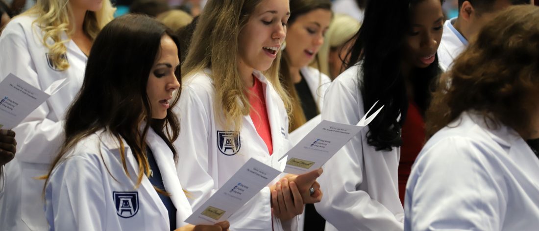 students with white coats