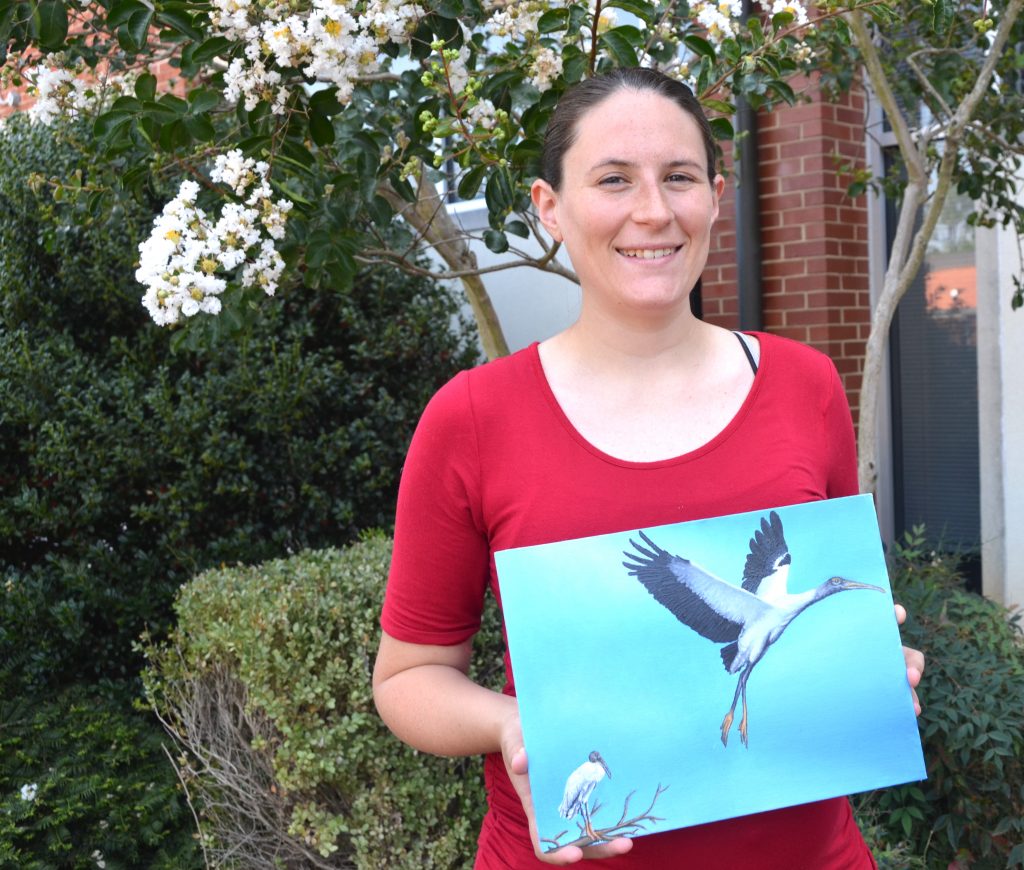 A woman with her painting.