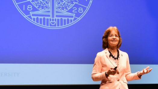Woman standing on stage.