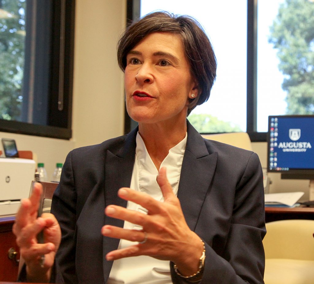 Woman talking in her office.