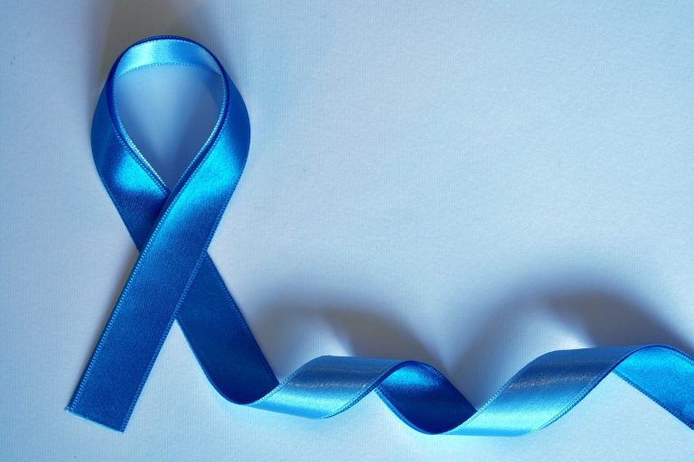 Blue ribbon representing a cancer awareness month