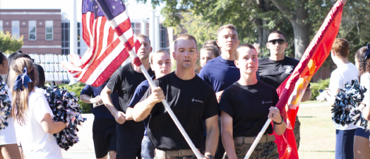 Soldiers carrying flags.