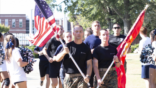 Soldiers carrying flags.