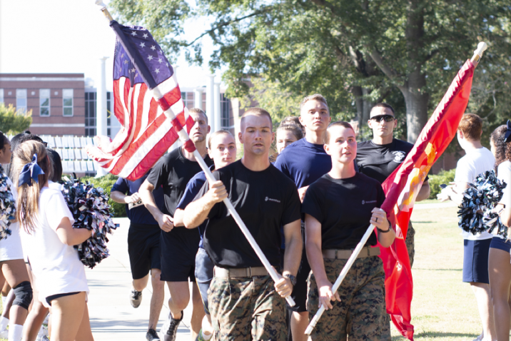 Soldiers carrying flags.