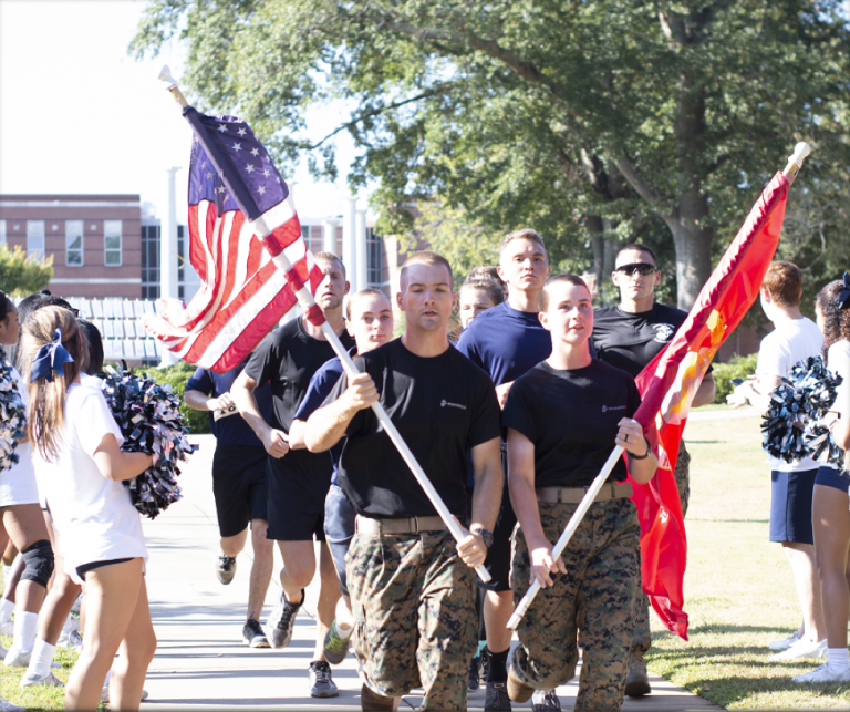Soldiers carrying flags.