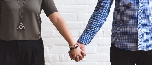 Couple holding hands.