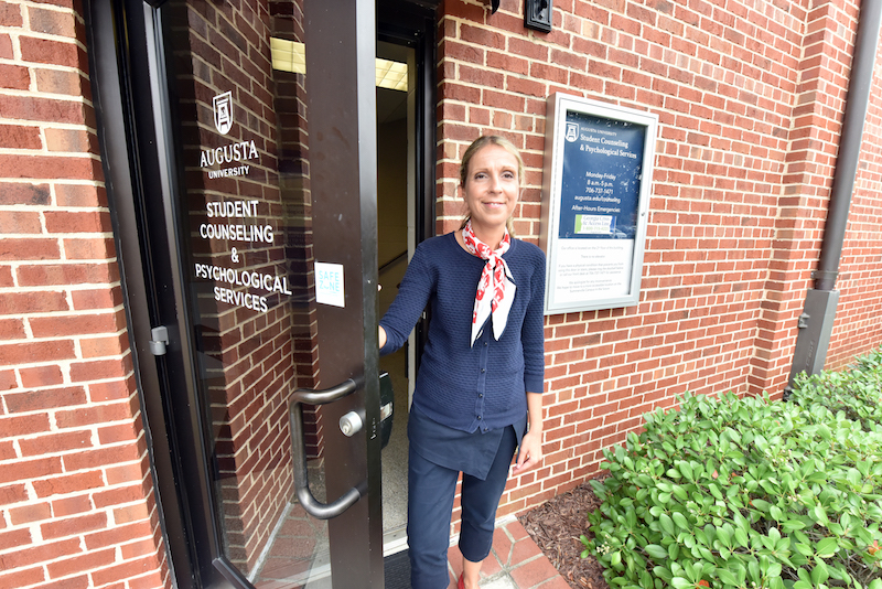 woman standing in doorway