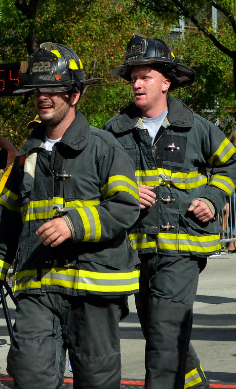 Two firefighters running
