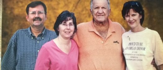 four people standing for photo