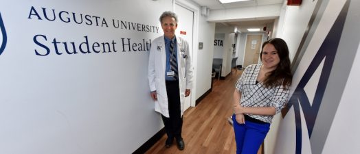 two doctors in a hallway
