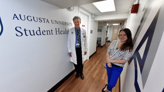 two doctors in a hallway