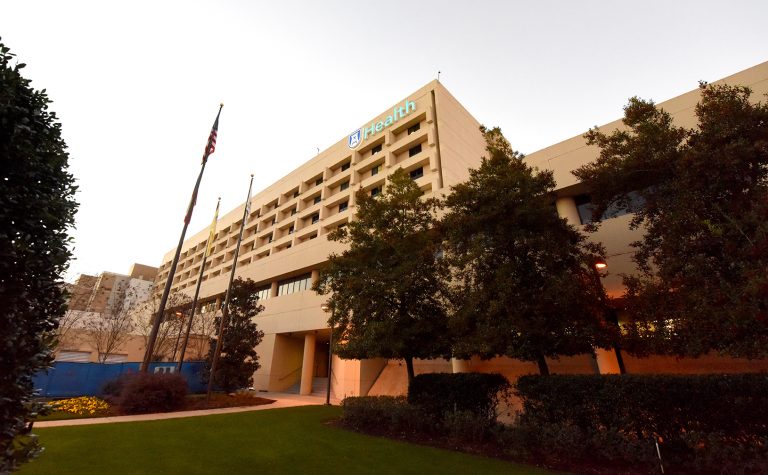 outside of a building with trees in front