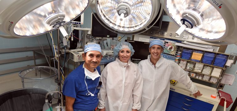 Three doctors in operating room