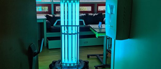 A robot giving off UV light in a hospital room.