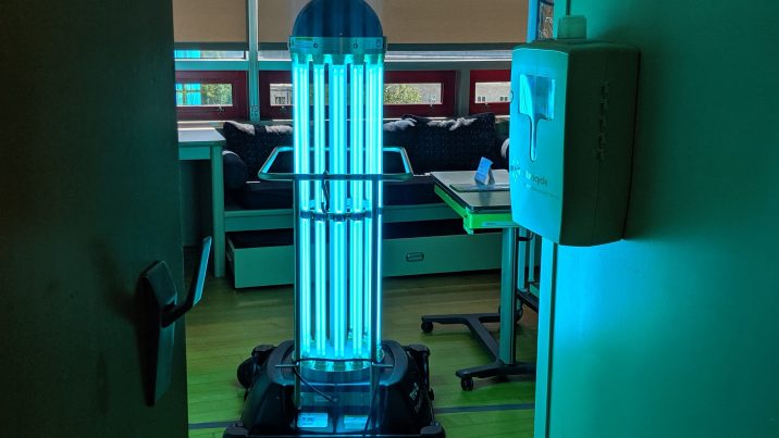 A robot giving off UV light in a hospital room.