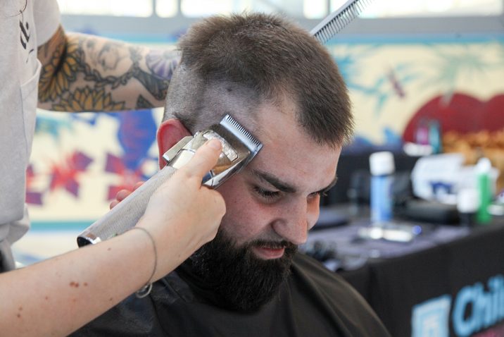 Person getting their haircut for fundraiser