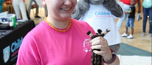 Person getting their haircut for fundraiser