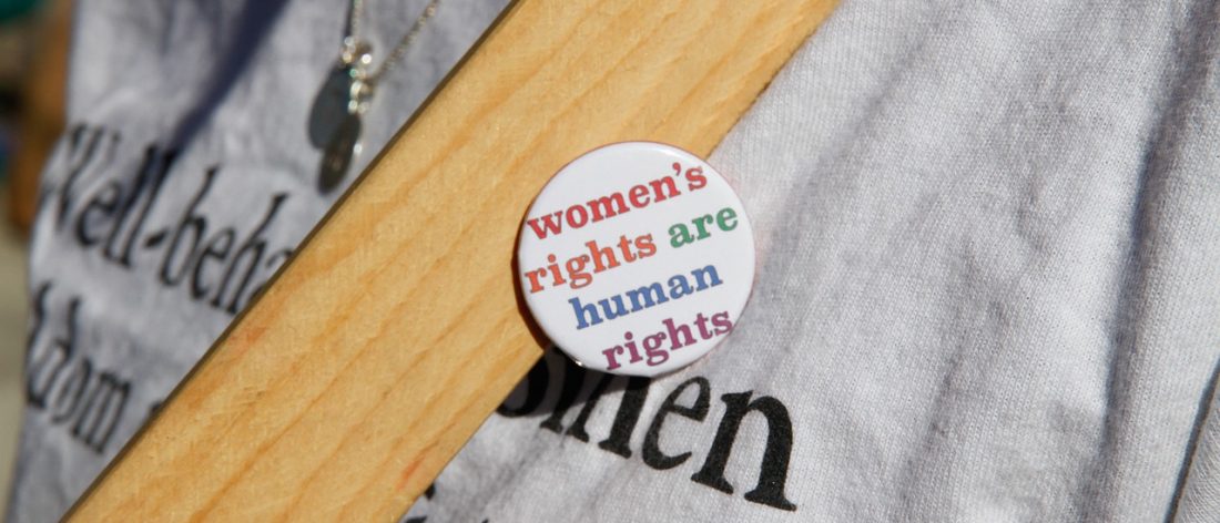 pin on shirt that says women's rights are human rights
