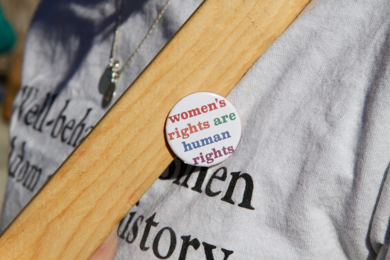 pin on shirt that says women's rights are human rights