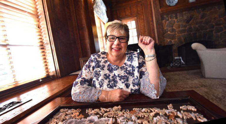 Woman sitting at a table.
