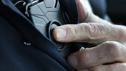 An officer with a body-worn camera.