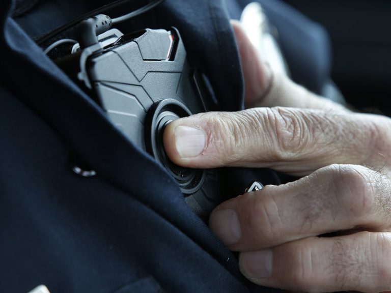 An officer with a body-worn camera.