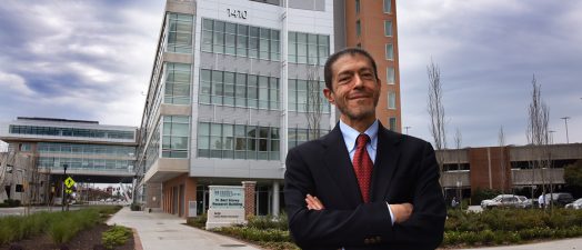 Doctor in front of building