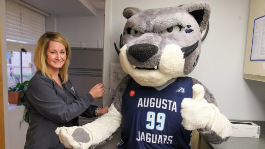 Photo of AU mascot Augustus getting a mock flu shot