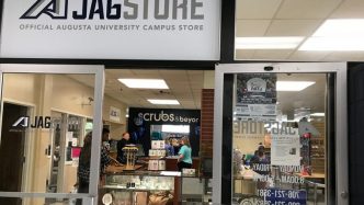 JagStore sign and glass doors entrance