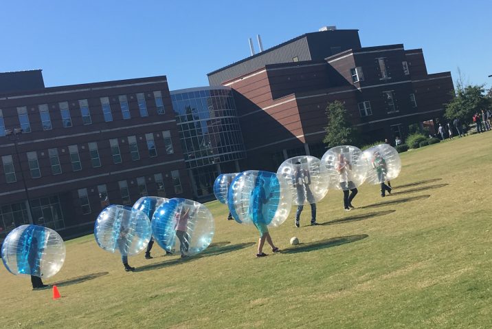 student playing bubble soccer