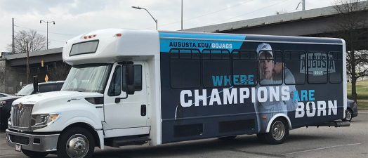 Augusta University bus with golf theme painted on outside