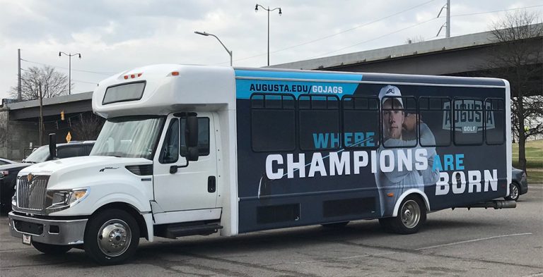 Augusta University bus with golf theme painted on outside